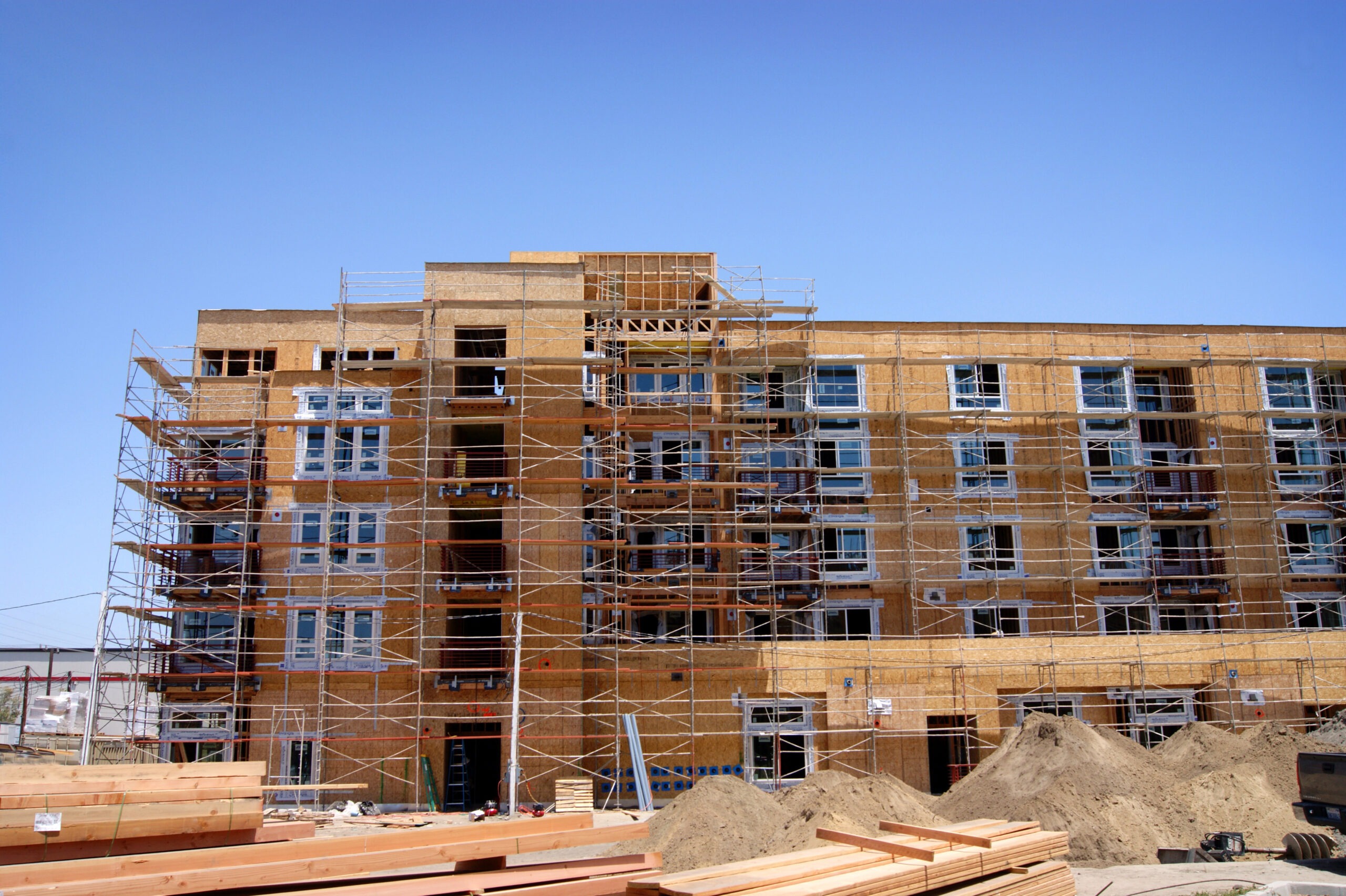 new building on construction site with scaffolding